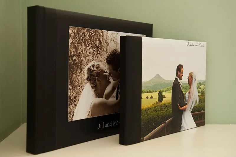 A wedding album showcasing two photos of a bride and groom, capturing the essence of their special day.