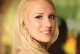 A stunning blonde woman in a wedding dress, exemplifying the elegance of wedding planning.