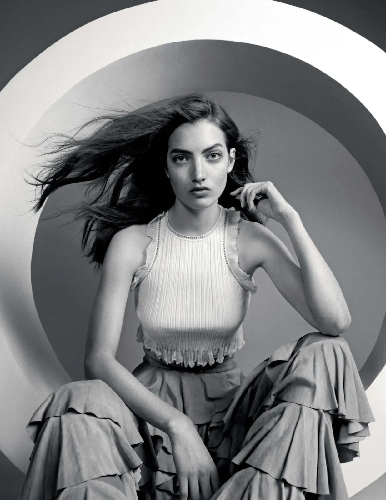 A black and white photo of a woman posing in a circle, perfect for wedding planning or wedding services.