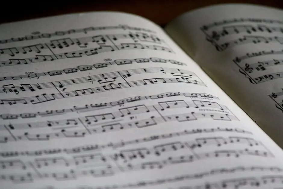 A sheet of music is open on a table, suggesting the planning of a wedding.