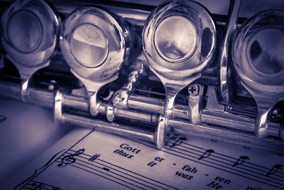 A clarinet resting on a sheet of music, perfect for wedding planning.