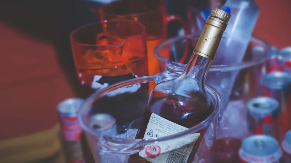 An elegant bottle of wine chilling in an ice bucket, perfect for wedding uk planning.
