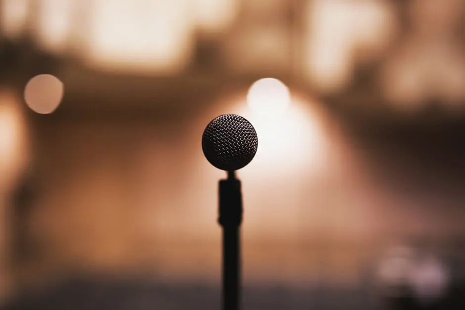 A microphone in front of a blurred background, perfect for wedding planning.