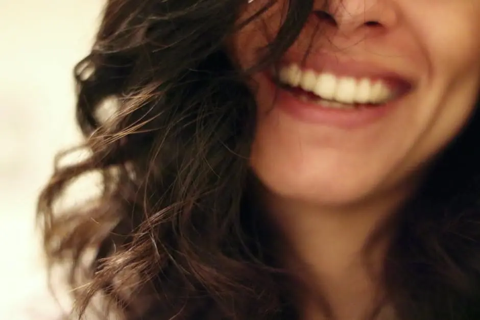 A close up of a woman laughing at a wedding business planning session in the UK.