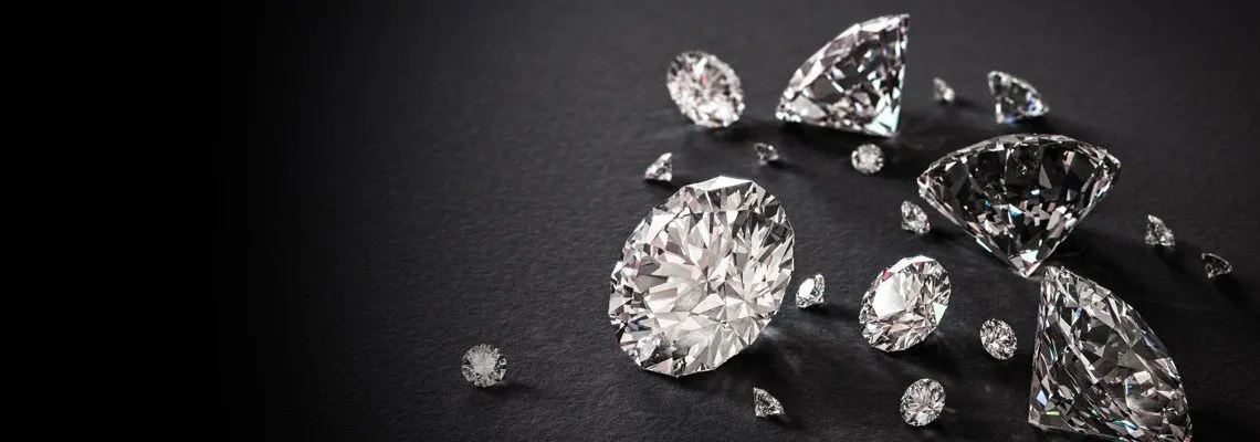 A group of diamonds on a black background fit for a luxurious wedding setting.