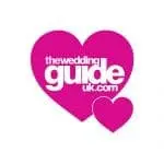 Logo of "theweddingguideuk.com" with the text inside a large pink heart and a smaller pink heart beside it.