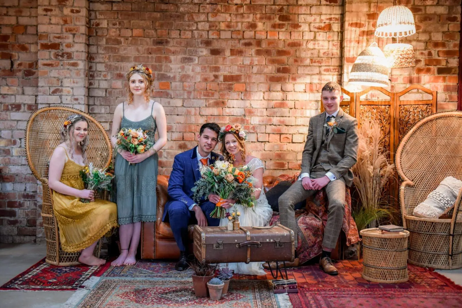 Small bridal party in a rustic barn setting.
