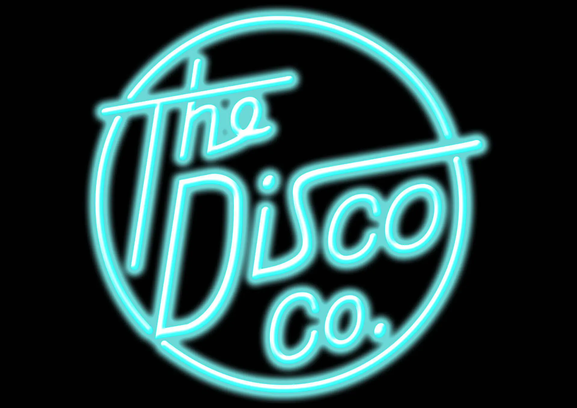 A neon sign in teal, displaying the words "The Disco Co." in cursive writing within a circular border on a black background.