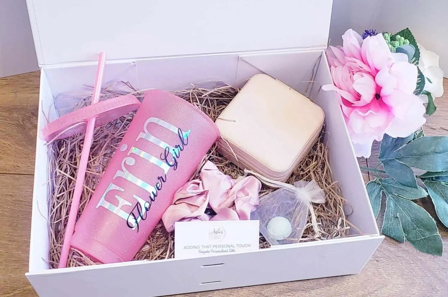 Gift box for a flower girl with personalised wedding gifts inluding a drink cup and jewellery box