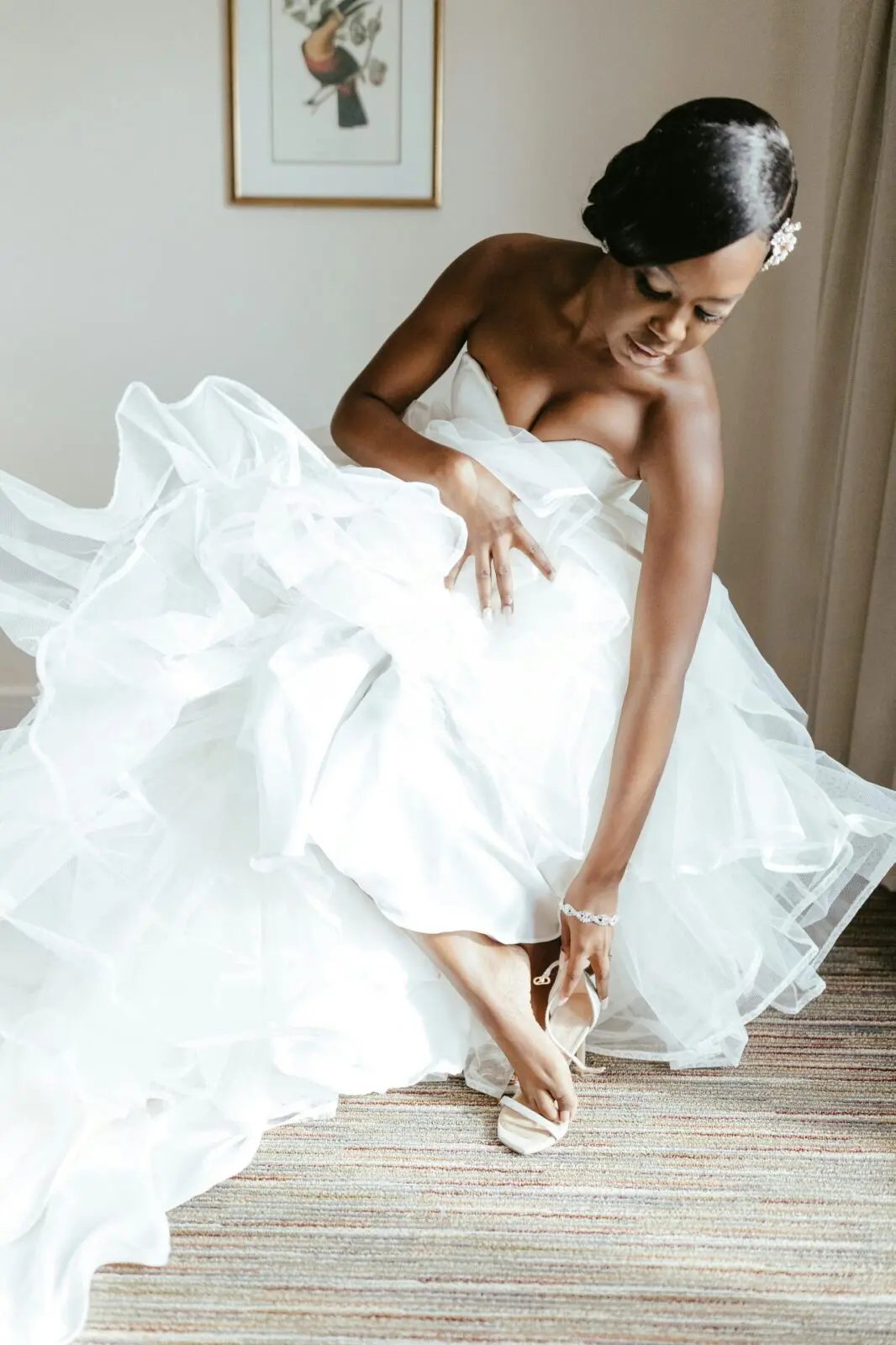 Bride in a white dress with bridal accessories of jewellery and strappy sandals.